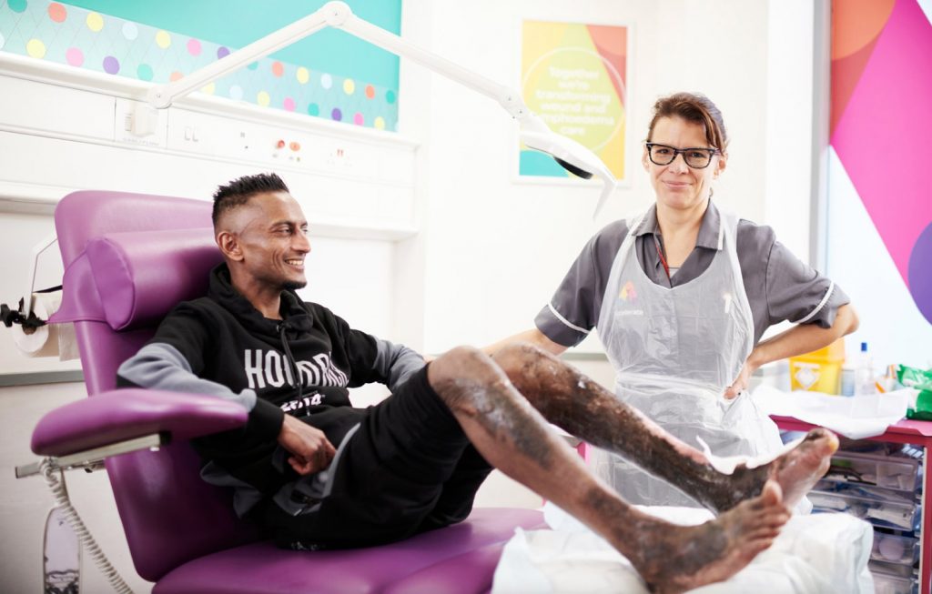 clinician and patient having leg ulcer treatment at the Acclerate centre for exellence in Hackney, London