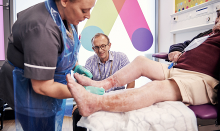 clinician, doctor and patient having leg ulcer treatment at the Acclerate centre for exellence in Hackney, London