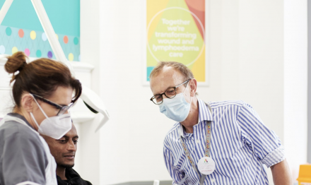 clinician, doctor and patient having leg ulcer treatment at the Acclerate centre for exellence in Hackney, London