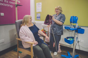 Clinician with seated patient in Accelerate treatment room